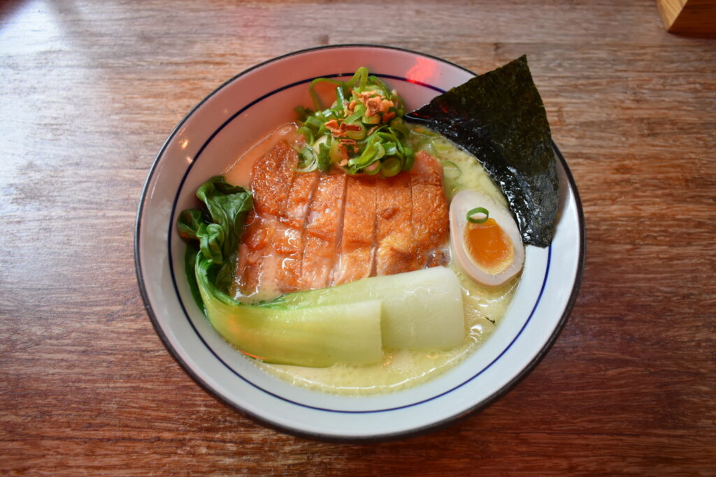 Noukou Chicken Ramen at Takumi De Pijp — creamy white broth topped with chicken chashu and green onions