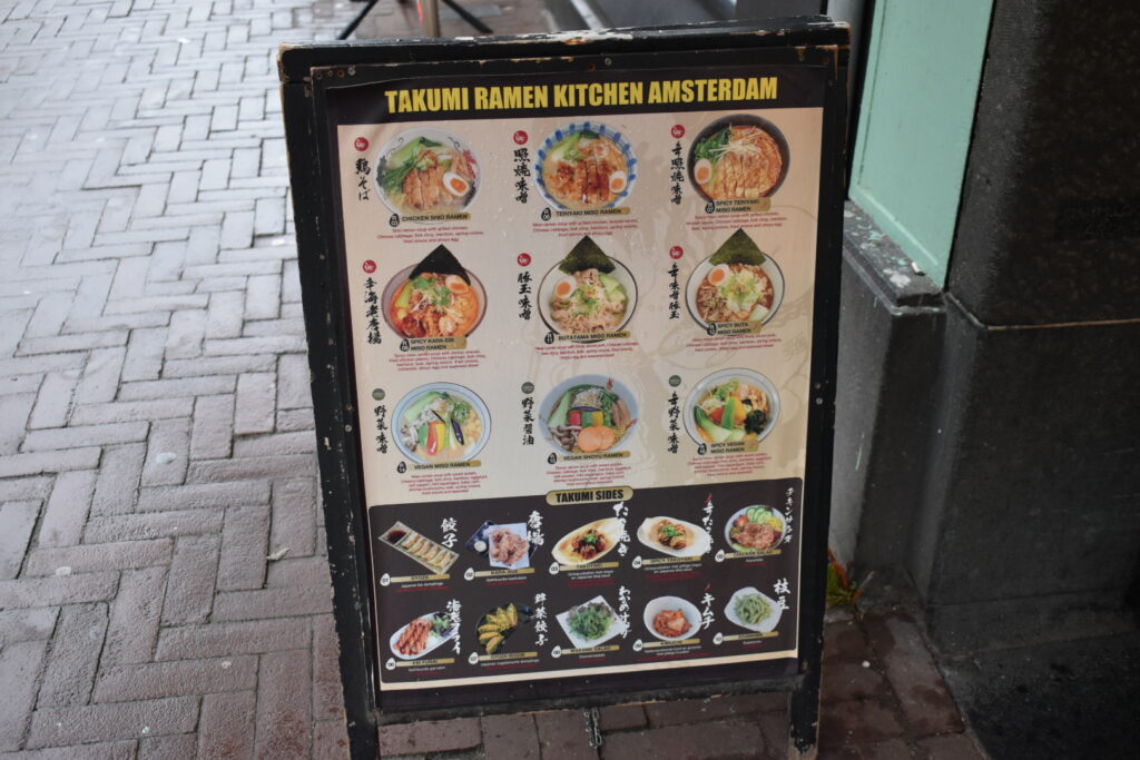 Exterior view of Takumi De Pijp in Amsterdam, a popular ramen spot often crowded even outside lunchtime