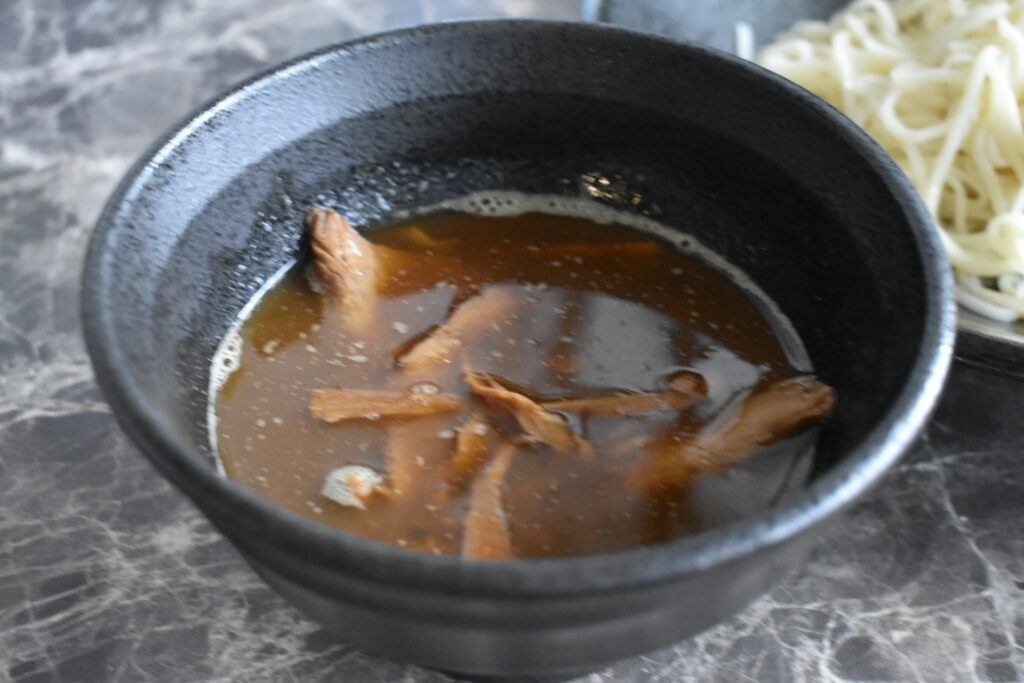 Sweet-sour and slightly spicy tsukemen dipping soup from Ramen Nikkou
