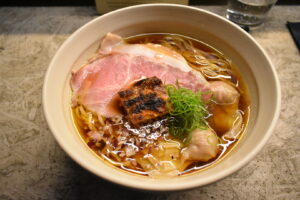 Shoyu ramen with pork chashu, wonton and charred tofu at Fuku Ramen Amsterdam