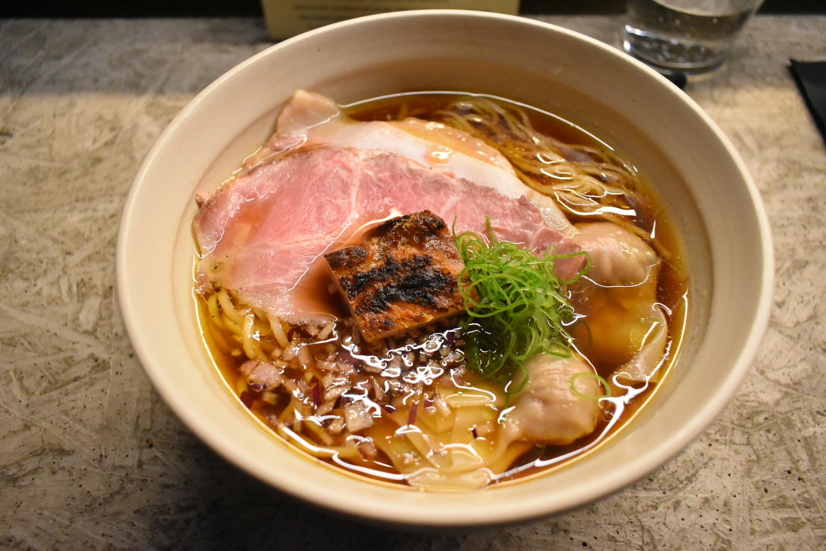 Shoyu ramen with pork chashu, wonton and charred tofu at Fuku Ramen Amsterdam