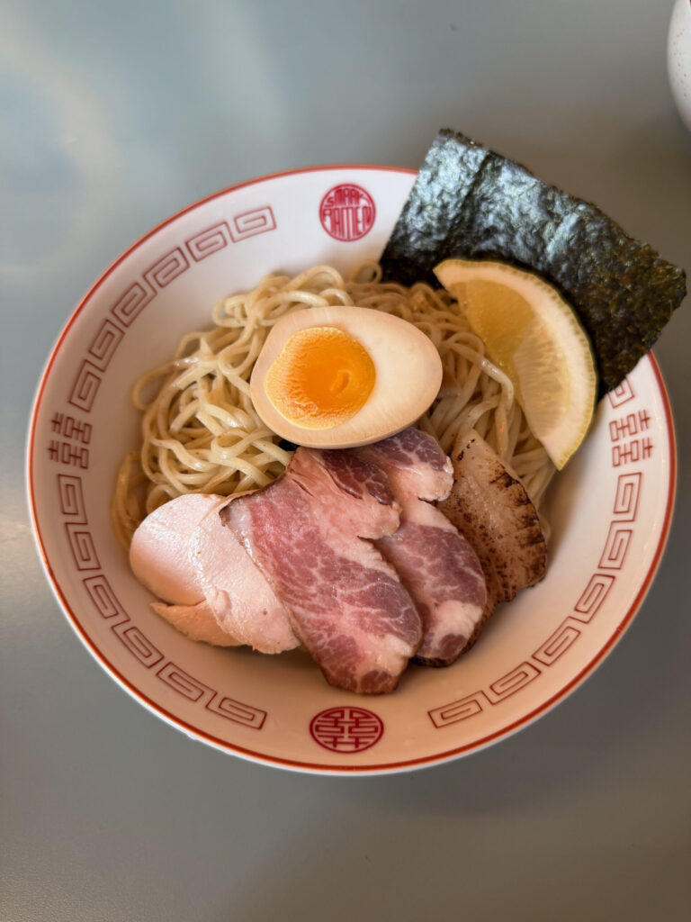 Tsukemen at Smaak Ramen Amsterdam with chashu, seasoned egg, nori, lemon, and shoyu dipping broth